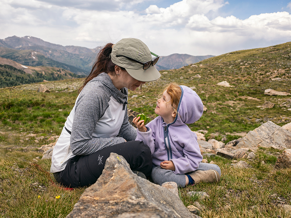 mother with daughter in mountains of colorado