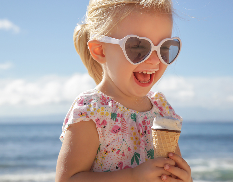 kid on beach eating ice cream