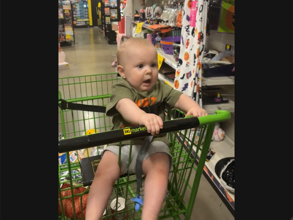 baby scared in shopping cart