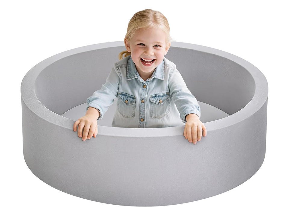 toddler in a ball pit 