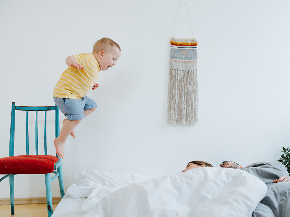 toddler jumping from chair