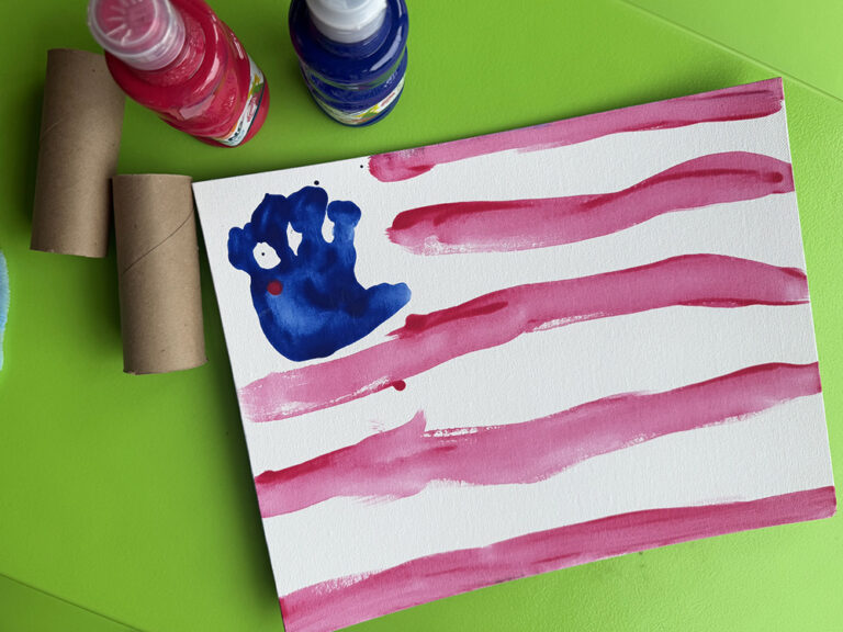 canvas with toddler handprint for stars and white and red stripes to make flag for fourth of july