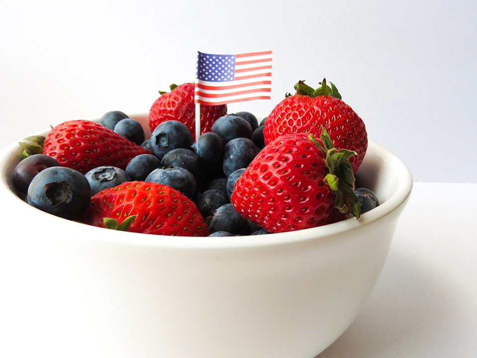 bowl of blueberries and strawberries with flag