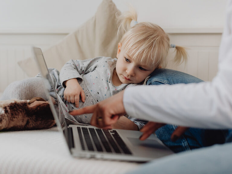 toddler looking at laptop